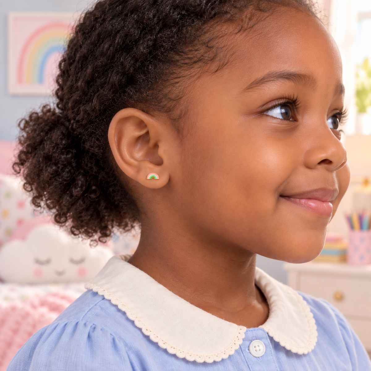 Rainbow hypoallergenic flat back earrings for children worn in a girl's ear