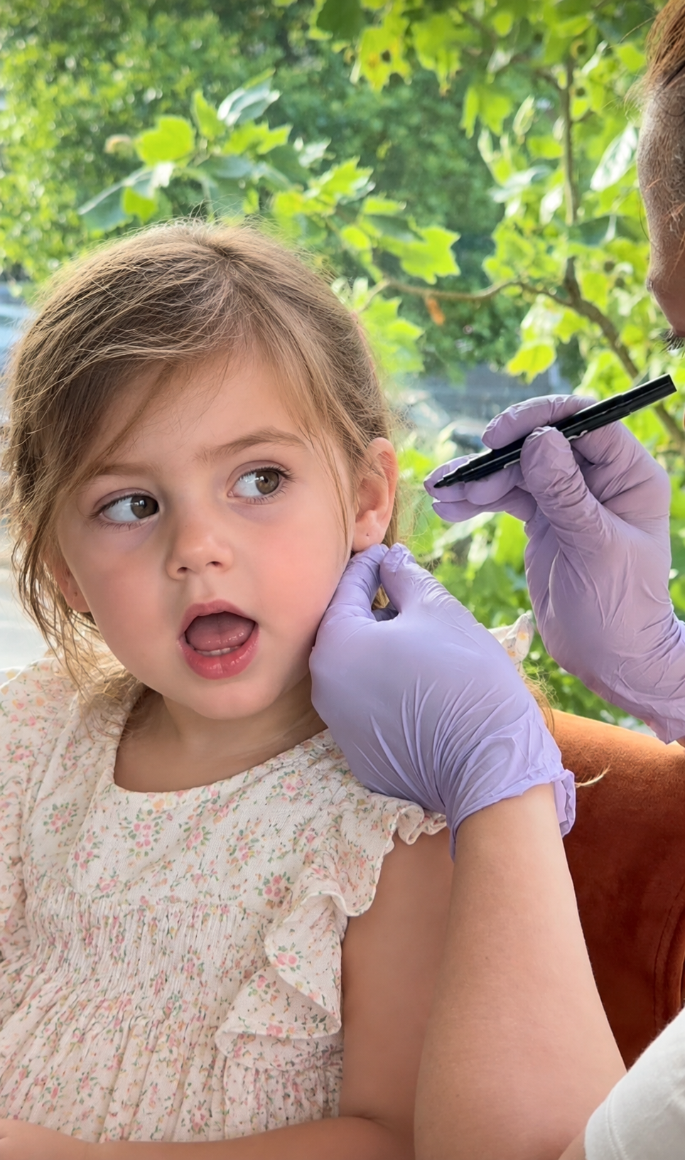 Autism-friendly ear piercing for children at home with a professional SPARKLN piercer