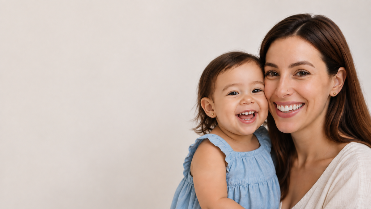 Mother and daughter wearing yellow gold stud earrings after an at-home ear piercing with SPARKLN