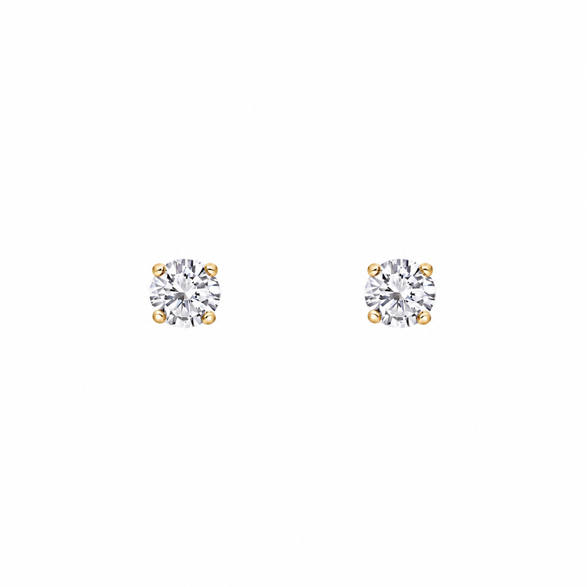 Pair of round clear crystal solitaire stud earrings with four gold-tone claws, shown on a white background.